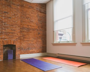 mats on cork floor in small yoga studio where we hold our yoga for beginner's classes